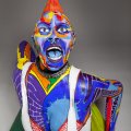 front view of ceramic sculpture of punk chick with colorful surface decoration